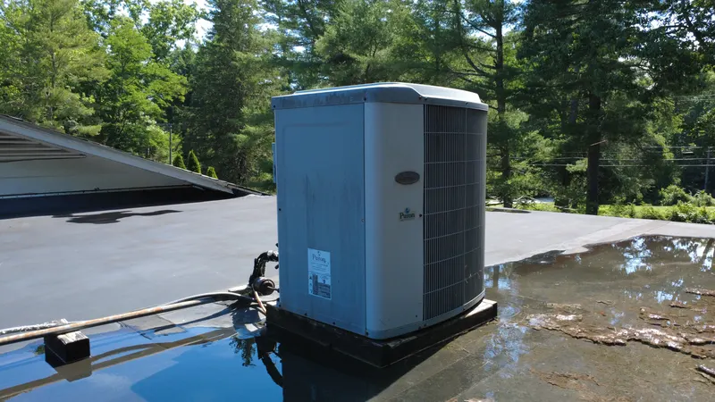 A rooftop HVAC unit on a flat roof