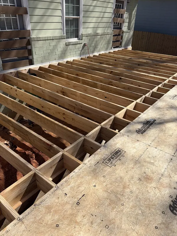 Floor framing on a home under construction, checked by AVL Inspections