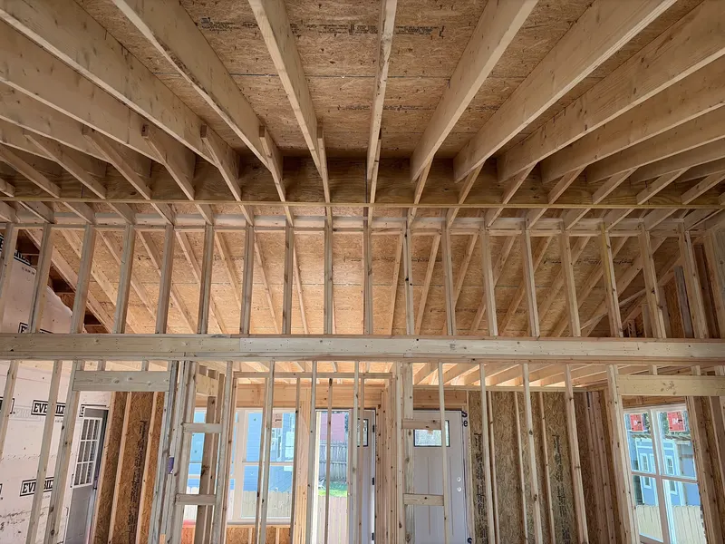 Wall framing on a home under construction, checked by AVL Inspections