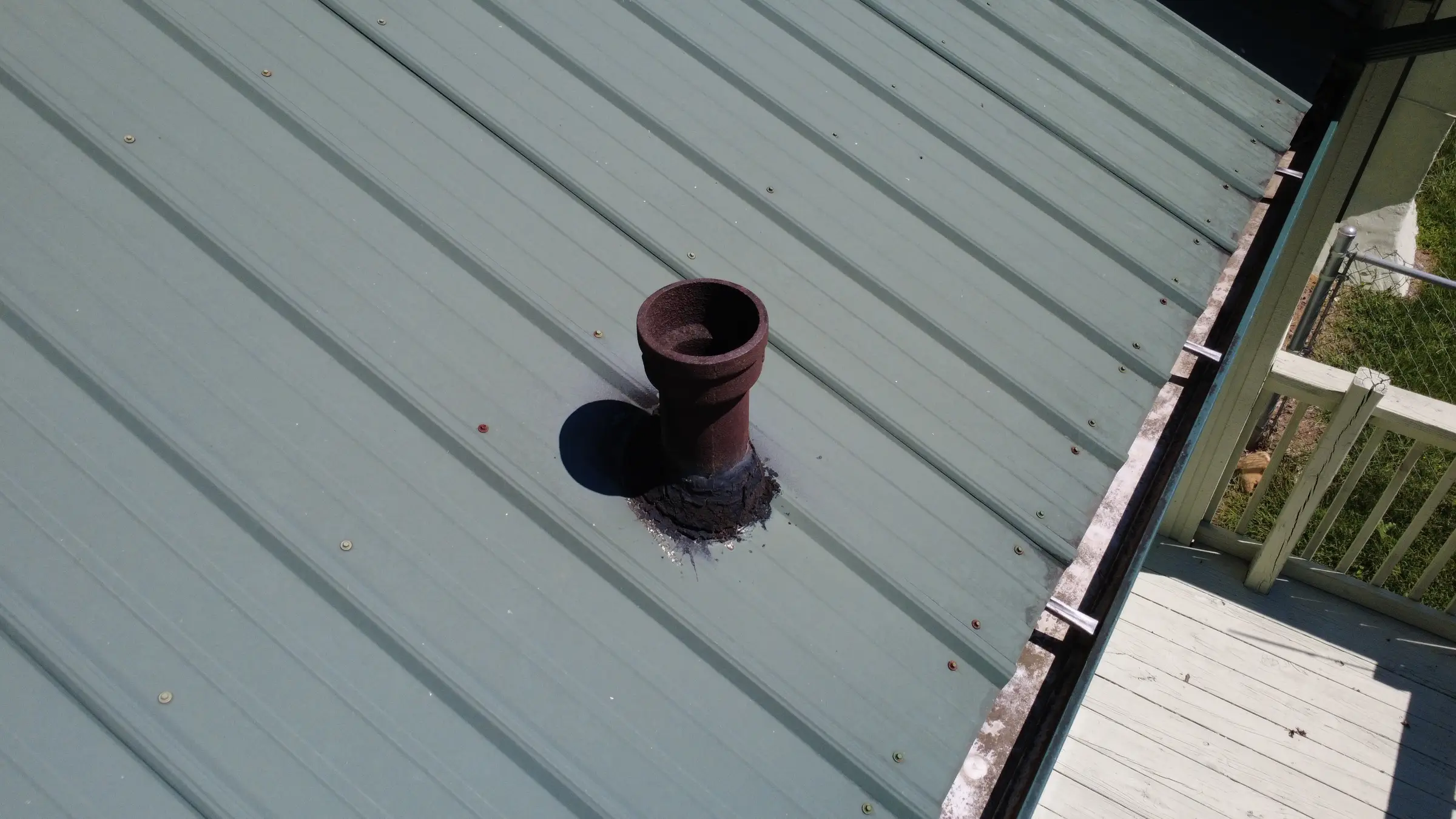 Plumbing vent on a metal roof, photographed by AVL Inspections, which offers septic inspection in Asheville