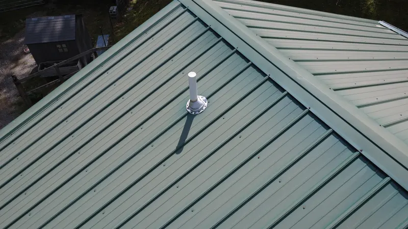 A plumbing vent on a metal roof